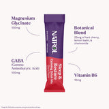 Natrol Sleep & Restore Magnesium Drink Mix in a glass of water