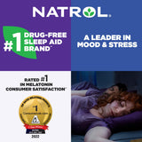 Natrol Time-Release Melatonin 5 mg Tablets in a hand for size reference