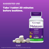 Natrol Time-Release Melatonin 5 mg Tablets on a table with a glass of water