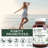 Natural Nutra Potassium Gluconate Supplement bottle with a measuring spoon
