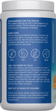 Natural Vitality CALM Magnesium Supplement Drink Mix 454g orange powder in glass