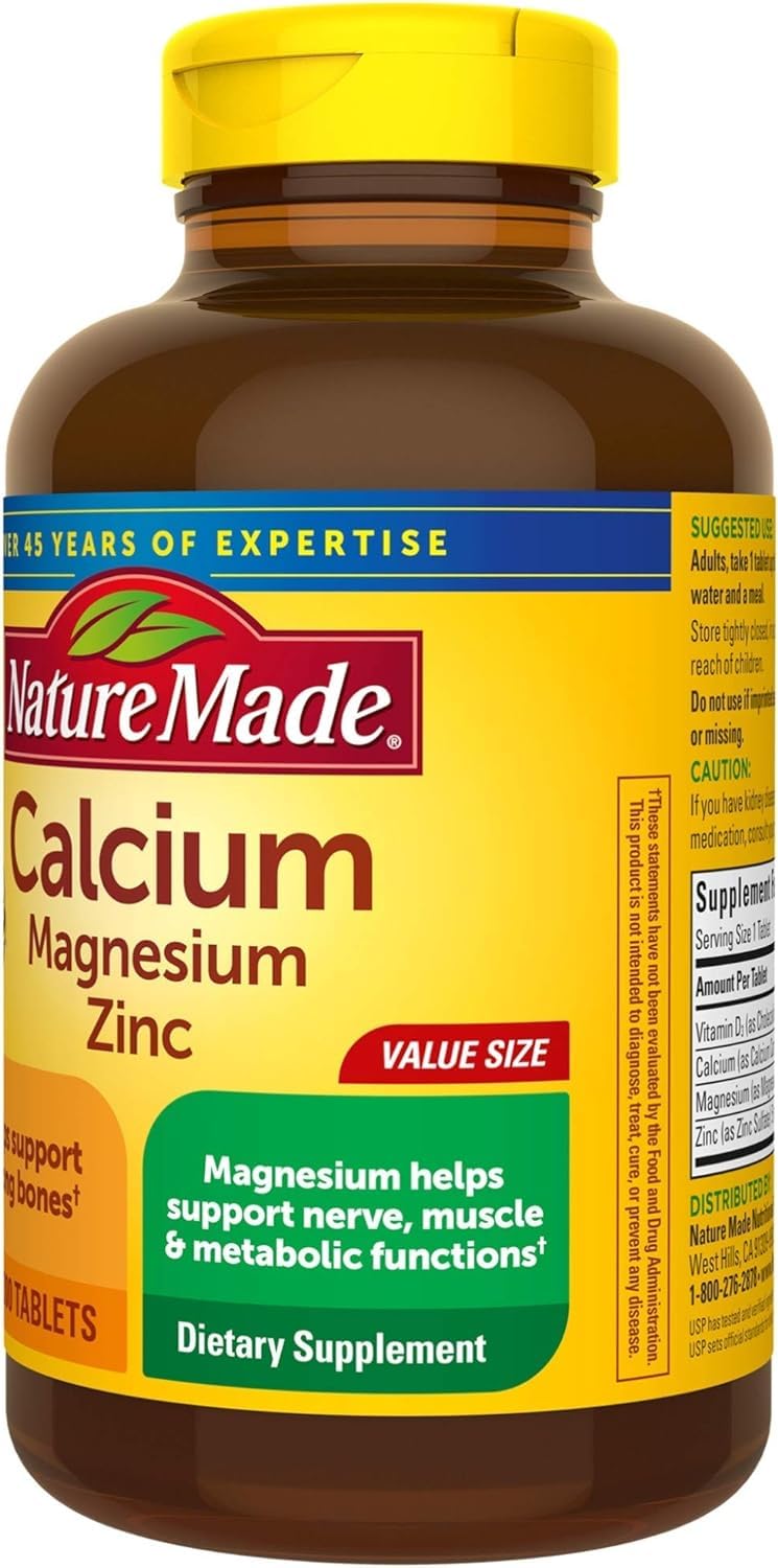 Nature Made Calcium Magnesium Zinc Vitamin D tablets in hand