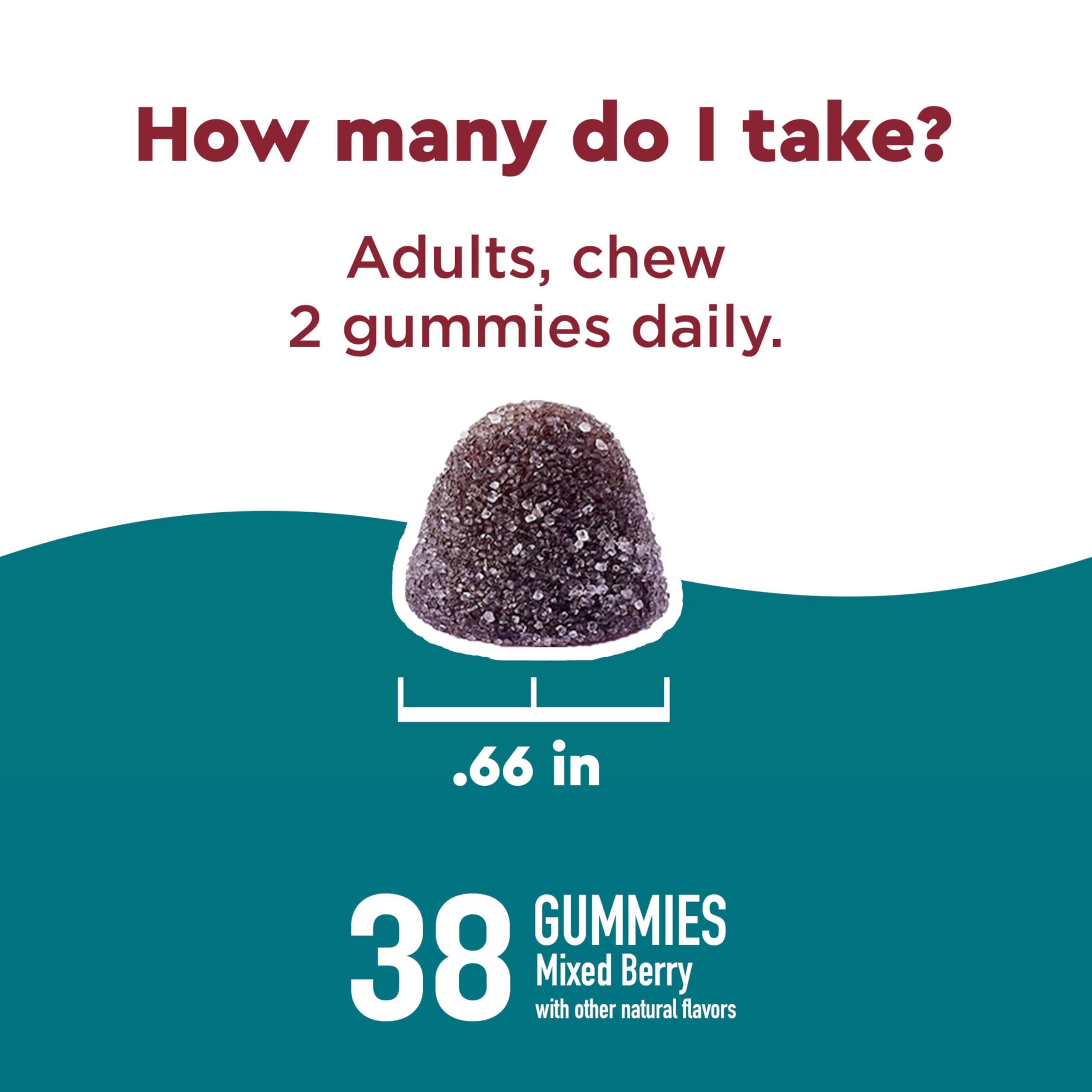 Nature Made Calm Mind & Body Gummies with a handful of gummies on a table
