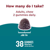 Nature Made Calm Mind & Body Gummies with a handful of gummies on a table