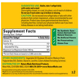 Nature Made Extra Strength Magnesium 400mg Softgels with a glass of water