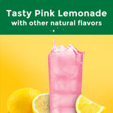 Nature Made Magnesium Complex Powder Drink Mix with a scoop and glass of mixed drink