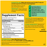 Nature Made Magnesium Complex Powder Drink Mix with water and a spoon