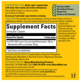 Nature Made Turmeric Curcumin Capsules 250mg on a wooden table