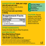 Nature Made Vitamin E softgels with a glass of water