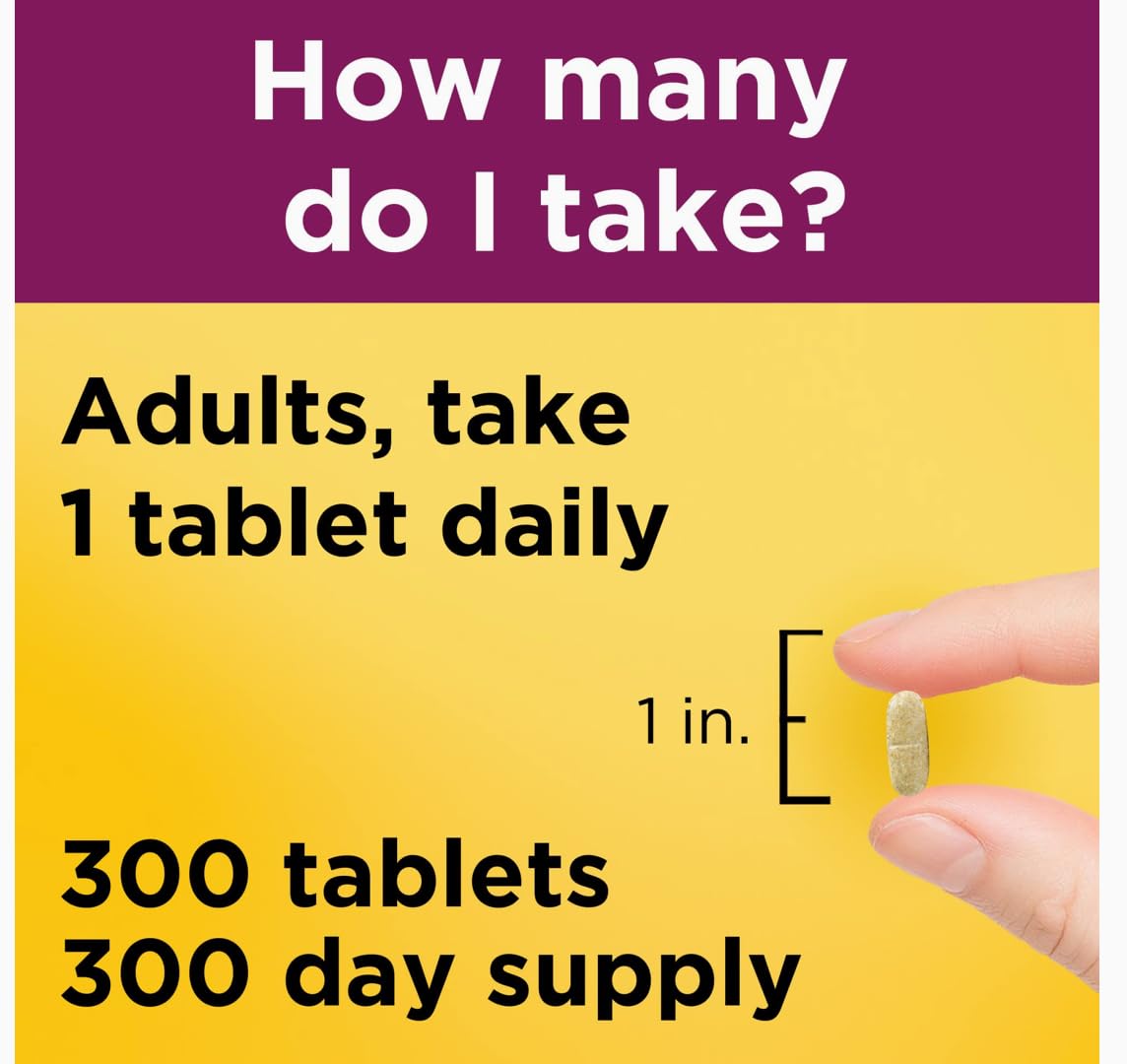 Nature Made Women's Multivitamin tablets in a hand