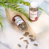 Nature Restore Pomegranate Extract Supplement in lifestyle setting on a wooden table