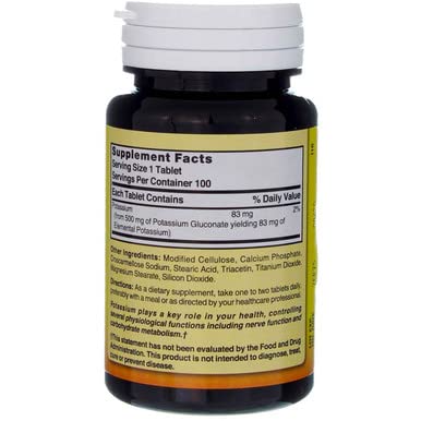 Nature's Blend Potassium Gluconate tablets in a hand
