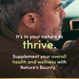 Nature's Bounty Activated Charcoal Capsules in hand