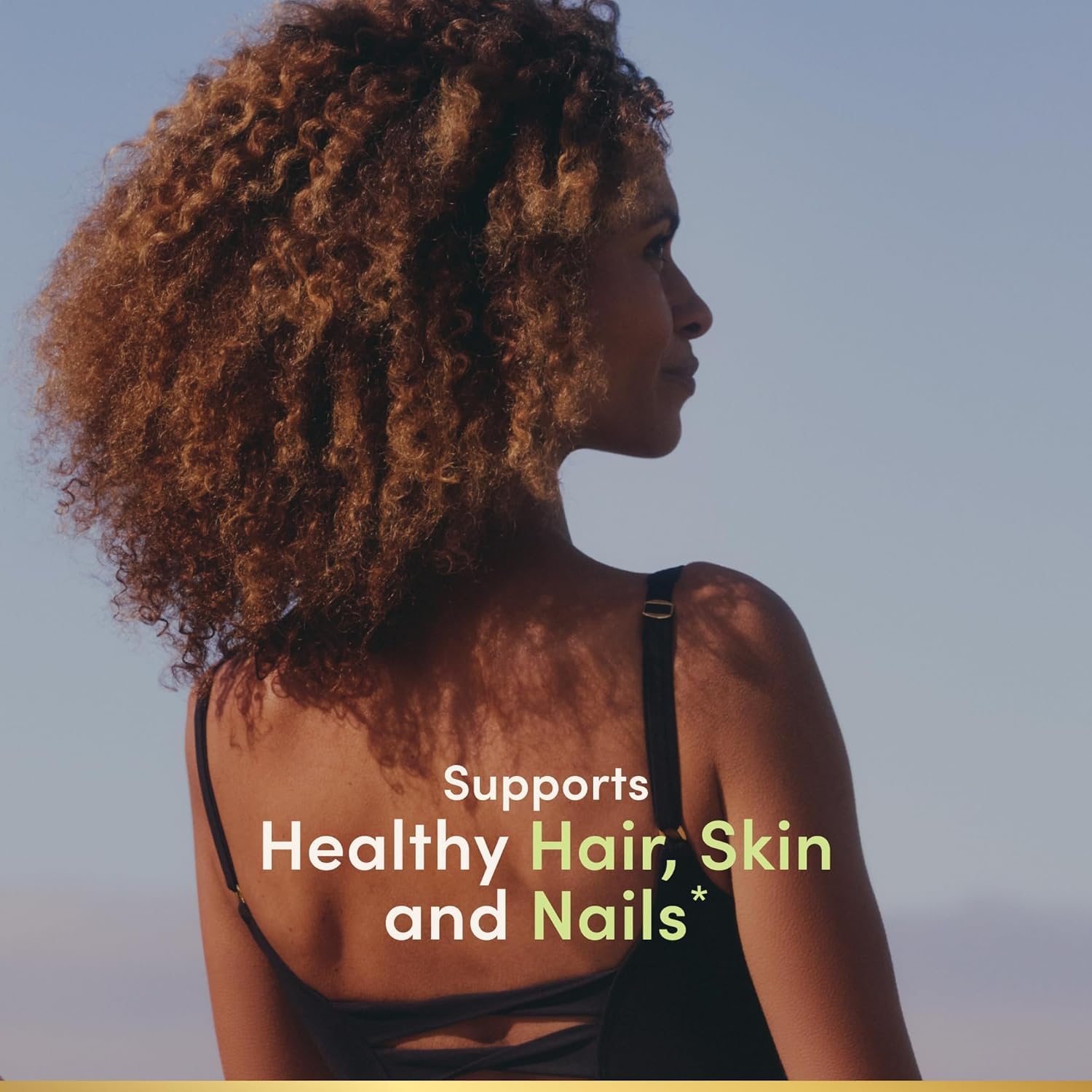 Nature's Bounty Biotin Softgels 5000 mcg softgel on a wooden table