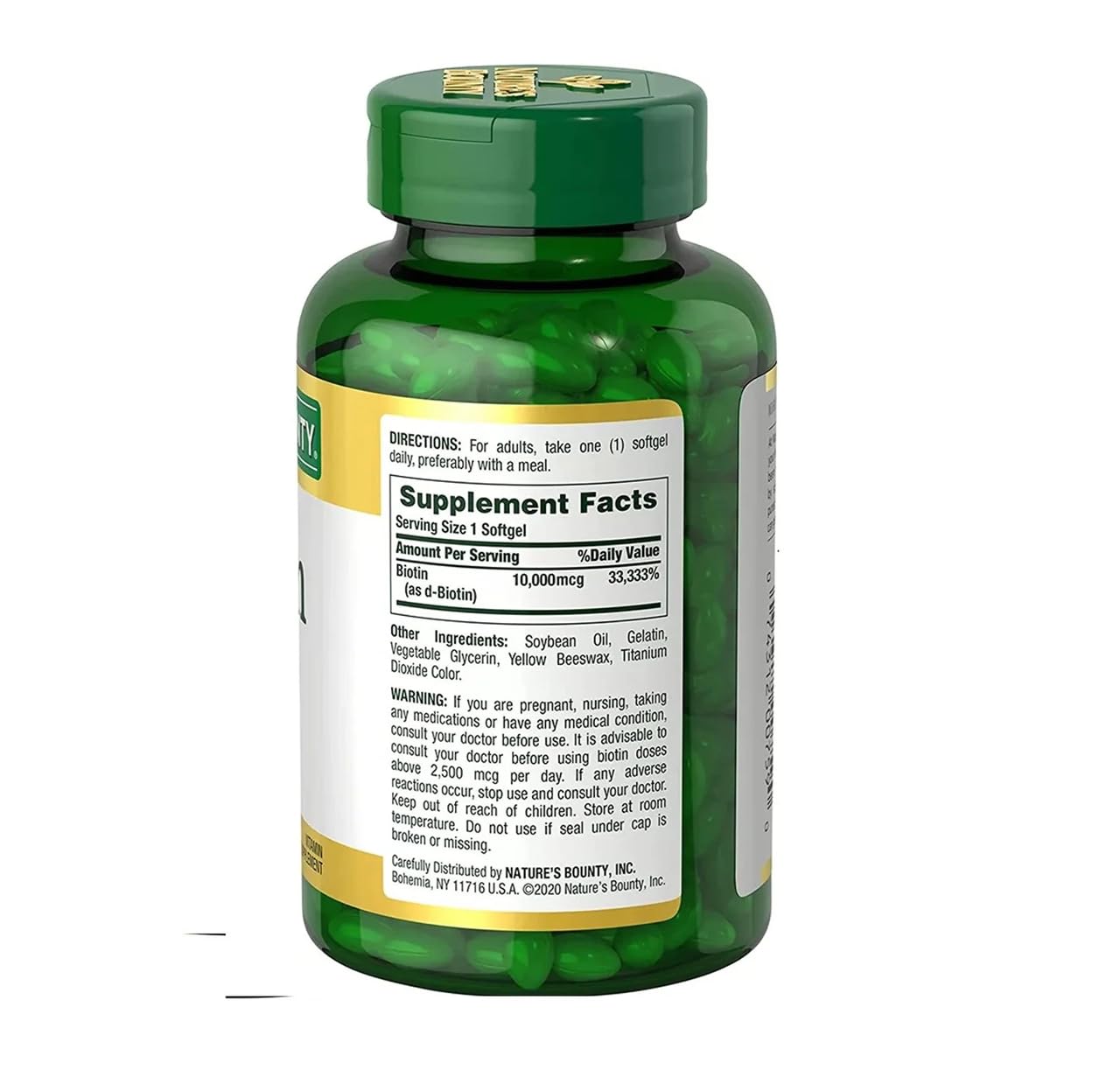 Nature's Bounty Biotin softgels on a wooden table with natural background