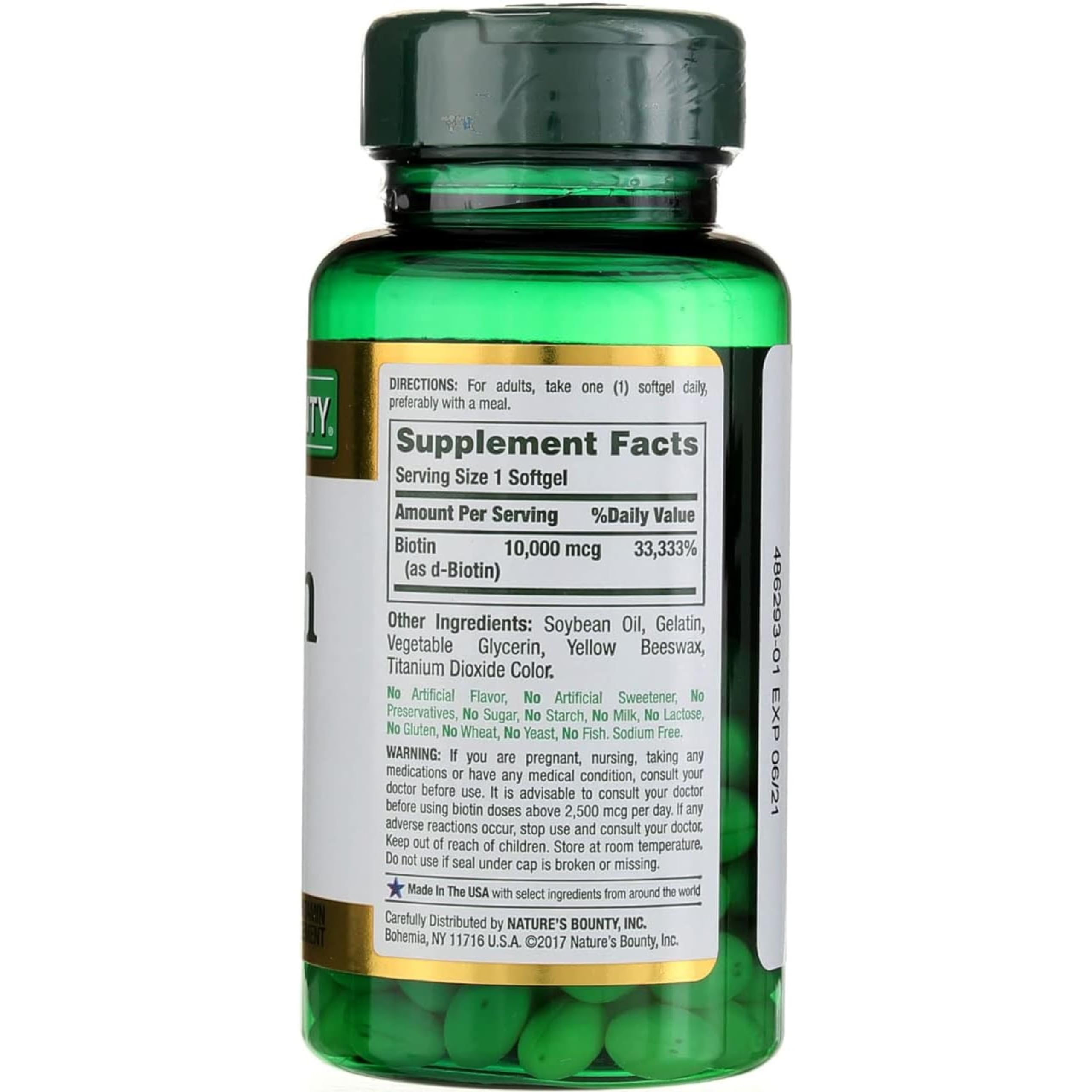 Nature's Bounty Biotin Supplement 68g with a glass of water