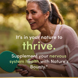 Nature's Bounty Niacin 500mg capsules with a measuring spoon