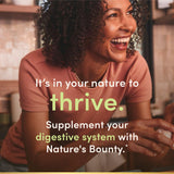 Nature's Bounty Probiotic GX with a measuring spoon and capsules