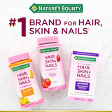 Nature's Bounty Skin, Hair and Nails Supplement with a measuring spoon