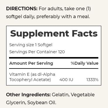 Nature's Bounty Vitamin E softgels on a wooden table