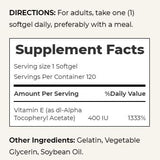 Nature's Bounty Vitamin E softgels on a wooden table
