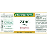 Nature's Bounty Zinc Caplets 50mg caplet in hand for size comparison