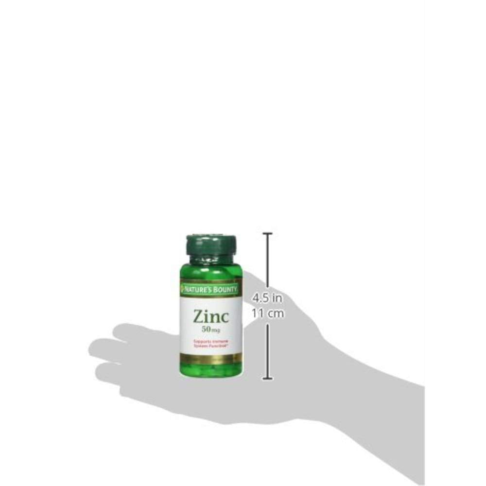 Nature's Bounty Zinc Caplets 50mg with a measuring spoon for dosage reference