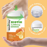 Nature's Key Biotin Gummies in a hand