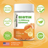 Nature's Key Biotin Gummies on a wooden table