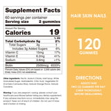 Nature's Key Biotin Gummies with a measuring spoon