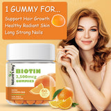 Nature's Key Chewable Biotin Gummies with fresh oranges