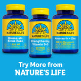 Nature's Life Bromelain Sinus Ease 490mg capsules on a wooden table