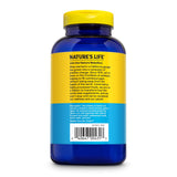 Nature's Life Cal Mag Zinc Complex tablets on a wooden surface