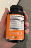 Nature's Nutrition Turmeric Curcumin Supplement 1800mg capsules on a wooden table