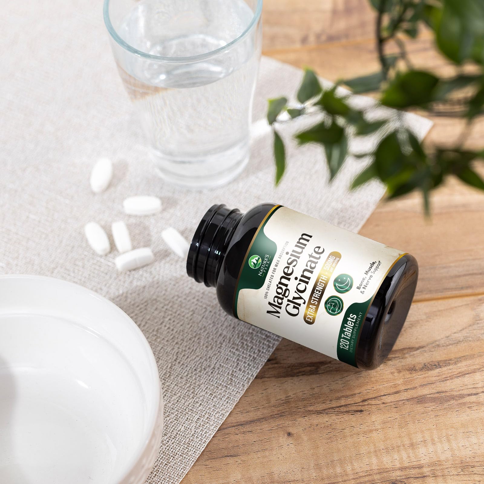 Nature's Peak Magnesium Glycinate 500mg supplement with a glass of water