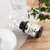 Nature's Peak Magnesium Glycinate 500mg supplement with a glass of water