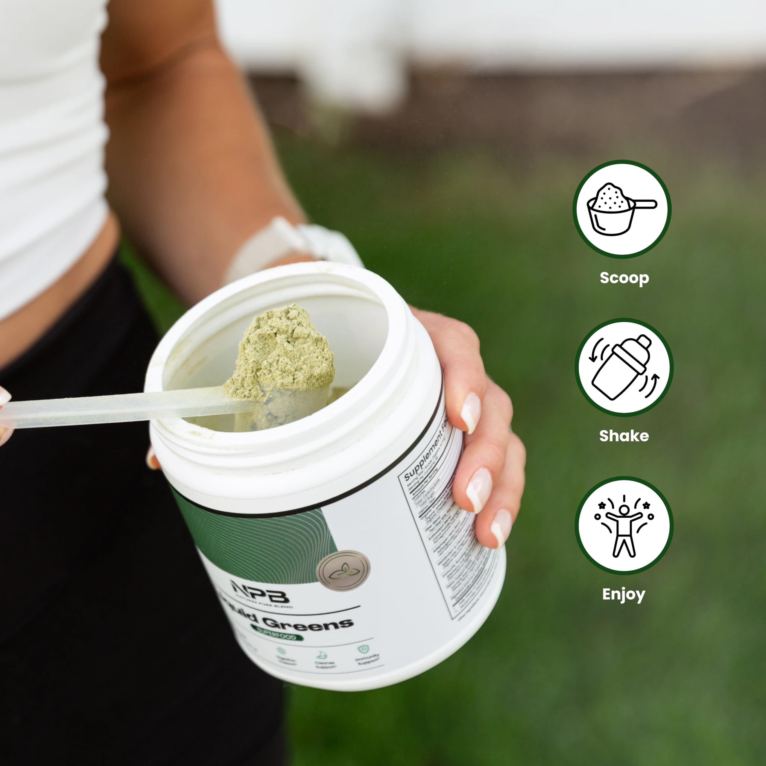 Nature's Pure Blend Organic Greens Powder in a glass of water
