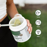 Nature's Pure Blend Organic Greens Powder in a glass of water
