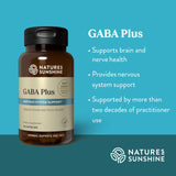 Nature's Sunshine GABA Capsules on a wooden table
