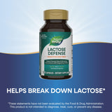 Nature's Way Lactose Defense multi-enzyme capsules on a wooden table