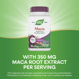 Nature's Way Maca Extract capsules on a wooden table