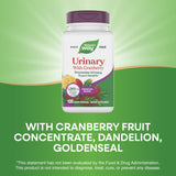 Nature's Way Urinary with Cranberry bottle with a glass of water