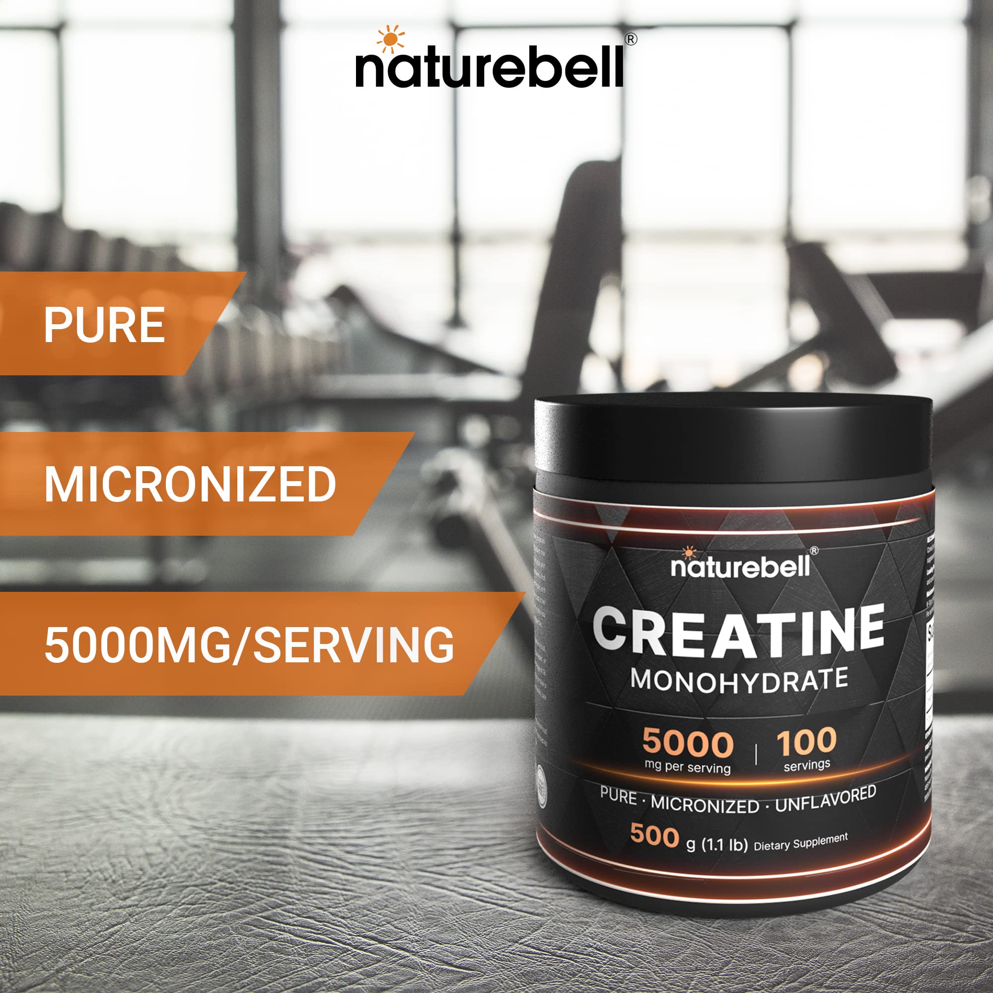 NatureBell creatine powder displayed with fitness accessories