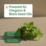 NatureBell Oil of Oregano with Black Seed Oil softgel with a measuring spoon