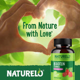 NATURELO Biotin Gummies 60 count bottle on a wooden table