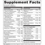 NATURELO Multivitamins for Women capsules on a wooden table