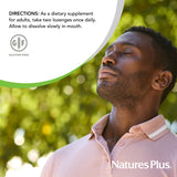 NaturesPlus Adult's Lozenges displayed with a fresh fruit background