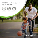NaturesPlus Chewable Vitamin C 100mg in a child's hand