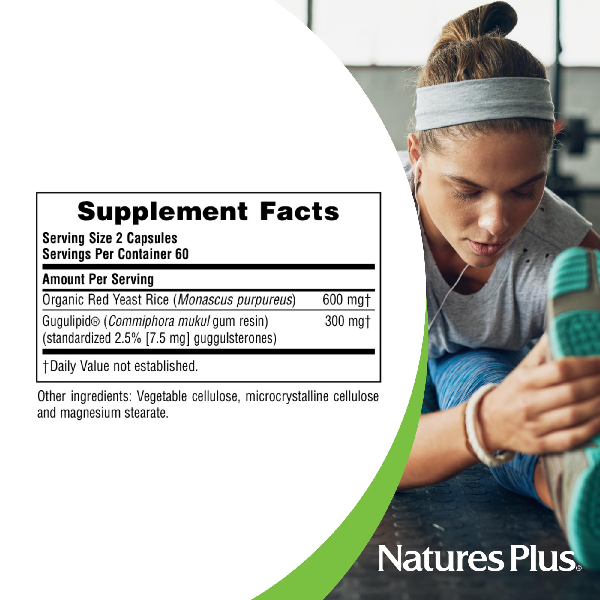 NaturesPlus Herbal Actives Red Yeast Rice & Gugulipid capsules on a wooden table
