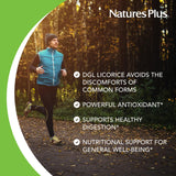 NaturesPlus Licorice Root DGL 500mg supplement capsule on a wooden table